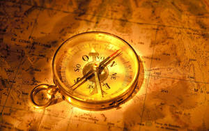 Gold Glowing Metal Compass Wallpaper