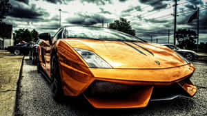 Gold Lamborghini Stands Out On The Road Wallpaper