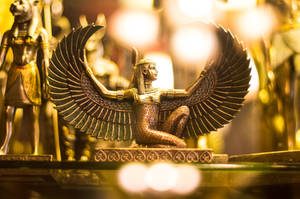 Gold Pharaoh Figurine With Wings Wallpaper