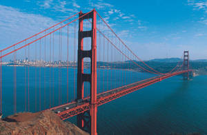 Golden Gate Bridge Suspended Over Blue Water Wallpaper