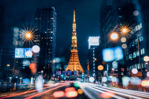 Golden Tokyo Tower With Defocused Lights Wallpaper