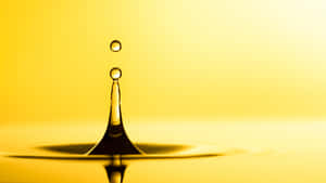 Golden Water Drop Splash Wallpaper