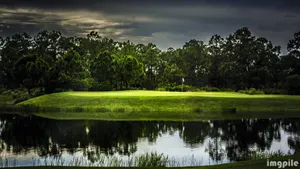 Golf Course And Dark Clouds Wallpaper