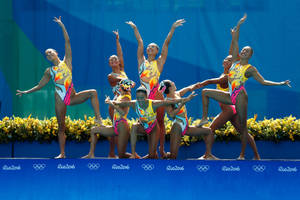 Graceful Synchronized Swimming At The Summer Olympics Wallpaper