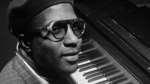 Grammy Award-winning Jazz Pianist Thelonious Monk In A Joyful Mood Wallpaper