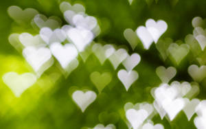 Green Hearts Blurry Wallpaper