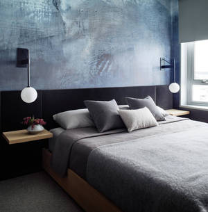 Grey Bed Inside A Bedroom Wallpaper