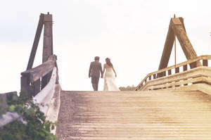 Groom And Bride On Bridge Wallpaper