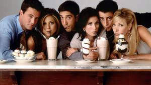 Group Friends Drinking Milkshakes Wallpaper