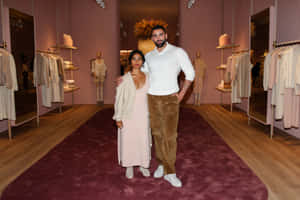 Guests Attending An Exclusive Loro Piana Fashion Event Wallpaper