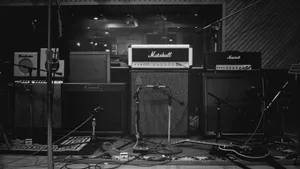 Guitar Player With His Vintage Tube Amp Wallpaper