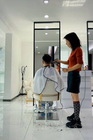 Haircut In Minimalist Salon Wallpaper