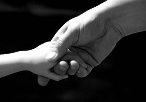 Hand In Hand Child And Parent Wallpaper