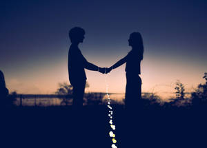 Hand In Hand Couple With Light Wallpaper
