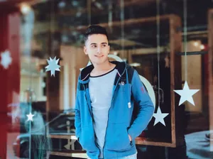 Handsome Boy Wearing Blue Jacket Wallpaper