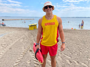 Handsome Lifeguard Beach Summer Vacation Wallpaper