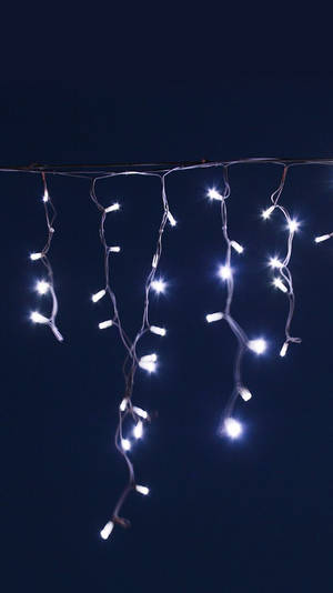 Hanging Blue Icicle Christmas Lights Wallpaper