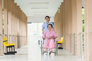 Happy Nursing Assisting Old Woman Wallpaper