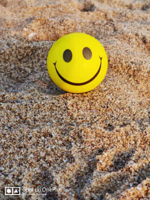 Happy Phone On Sand Wallpaper