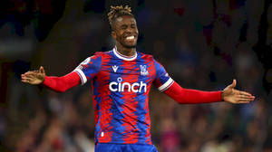 Happy Wilfried Zaha With Arms Spread Wallpaper