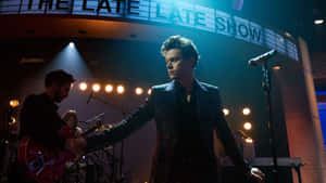 Harry Styles Rocking Out On His Laptop Wallpaper