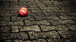 Hd Basketball Ball In Brick Ground Wallpaper