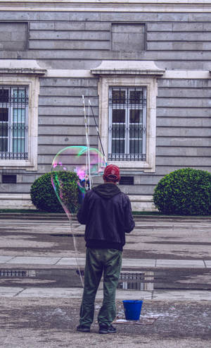Hd Man Playing With Bubbles Wallpaper