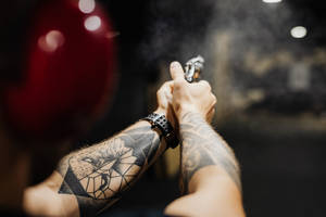 Hd Tattoo Person Holding Gun Wallpaper