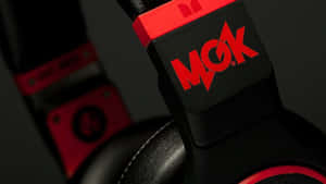 Headphones With Mgk Logo Wallpaper