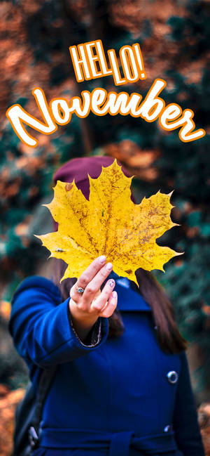 Hello November Woman Holding Leaf Wallpaper