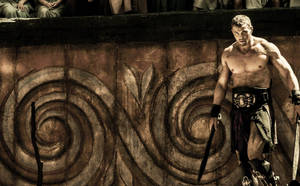 Hercules Unleashed: The Mighty Greek Hero Wielding Dual Swords Wallpaper
