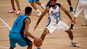 High-intensity Basketball Action Wallpaper