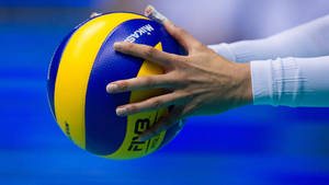 High Jump Serve In Volleyball Action Wallpaper