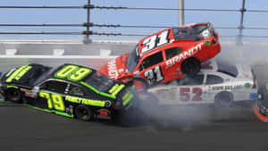 High-speed Action At The Nascar Racing Event Wallpaper