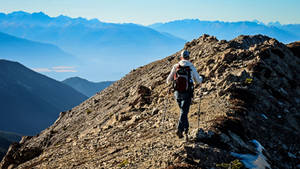 Hiker Journey In Rocky Mountain Wallpaper