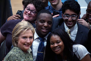 Hillary Clinton Interacting With Students Wallpaper