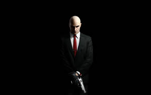 Hitman Full 4k Suit And Gun Wallpaper