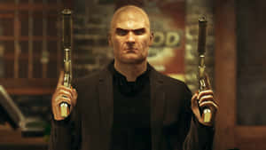 Hitman Holding Guns Desktop Wallpaper