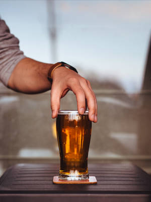 Holding Glass Of Beer Wallpaper