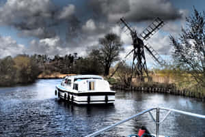 Holiday Cruise On Norfolk Broads Under A Dark Sky Wallpaper