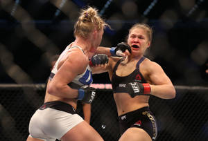 Holly Holm Versus Ronda Rousey Mma Wallpaper