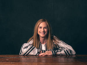 Holly Hunter Sitting Pose Smile Arms Table Wallpaper