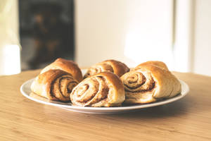 Homemade Cinnamon Rolls On The Table Wallpaper