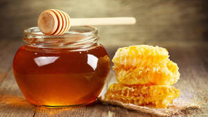 Honey Jar And Honeycomb Wallpaper