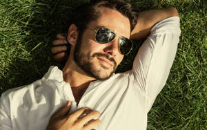 Hot Guy Lying On Grass Wallpaper