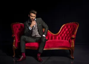 Hot Guy On Red Couch Wallpaper