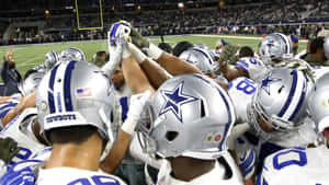 Huddling Team Of Dallas Cowboys Iphone Wallpaper