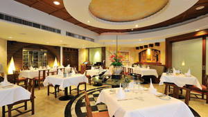 Huge Restaurant Hall With Table Setting Wallpaper