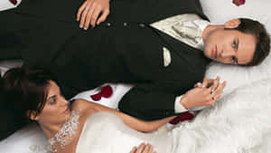 Husband And Wife Wedding Lying Down Wallpaper