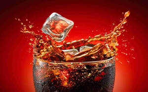 Ice Cube On Cola Drink Wallpaper